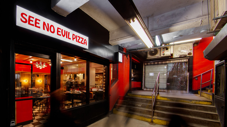 The entrance of See No Evil Pizza inside a NYC subway station.