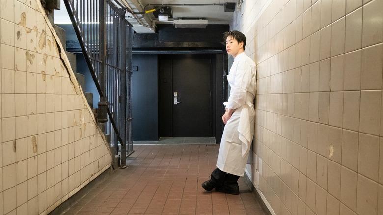 Chef Dae Kim outside the subway station entrance to his restaurant.