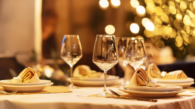 restaurant table setting with wine glasses