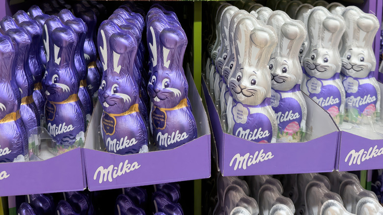 Purple and white Milka chocolate bunnies displayed at the supermarket