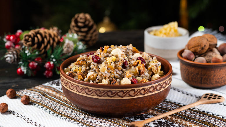 A bowl of traditional kutya from the Ukraine sits on a table decorated for the holiday.