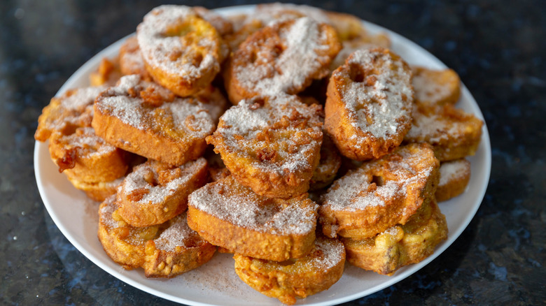 A plate is filled with rabanada, Brazilian french toast.