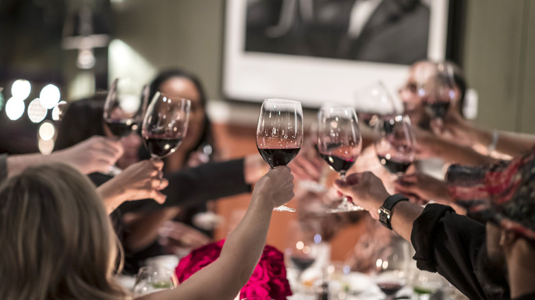 A group toasts at a private dining event at the Food & Wine Classic Aspen