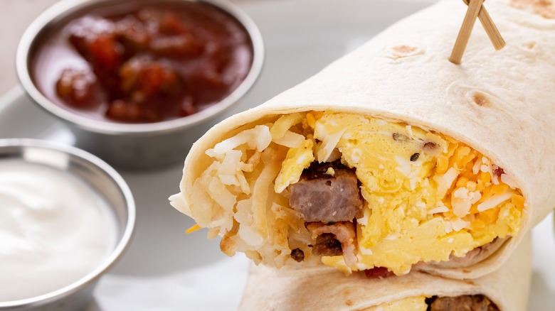 Breakfast burrito with dipping sauces