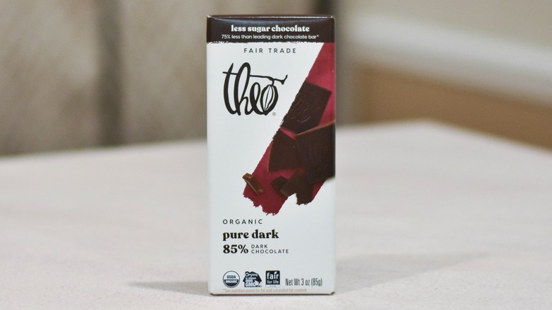 A bar of Theo dark chocolate on a white counter