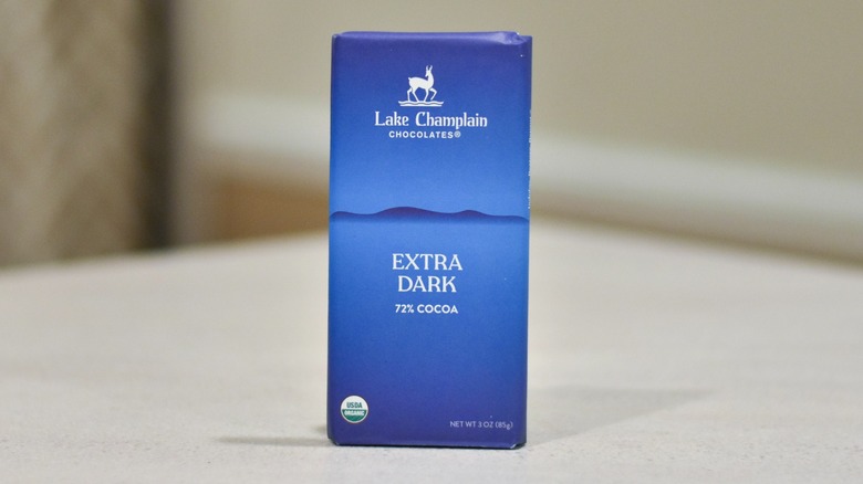 A bar of Lake Champlain extra dark chocolate on a white counter