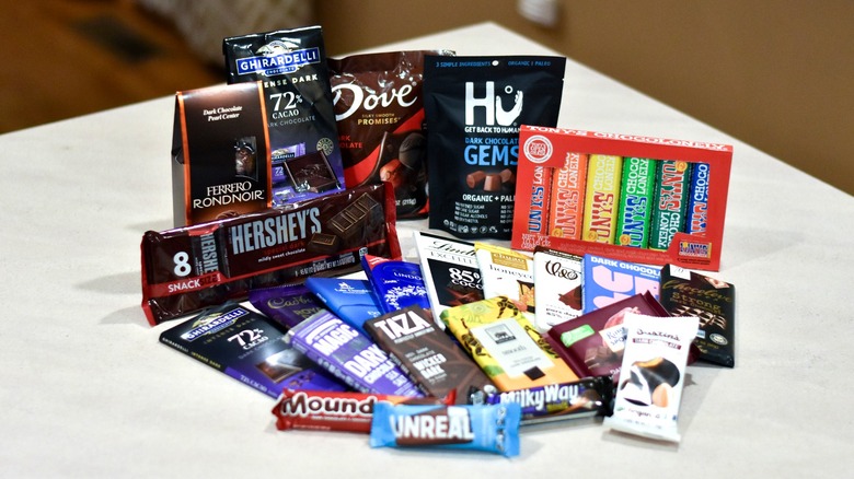 A selection of dark chocolate bars on a white countertop