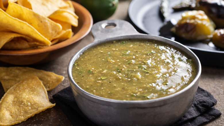 Roasted salsa verde in gray bowl with tortilla chips