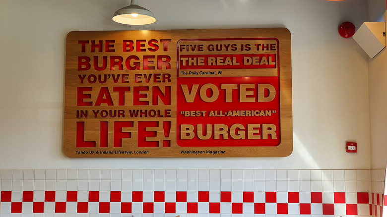 A sign inside a Five Guys restaurant