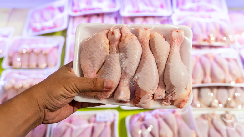 Raw chicken wrapped in plastic