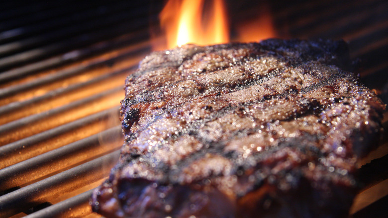close up ribeye steak on grill