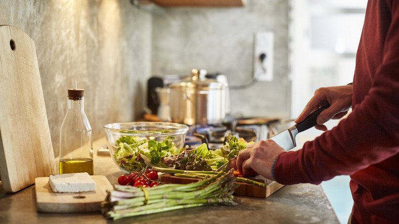 person prepping vegatables