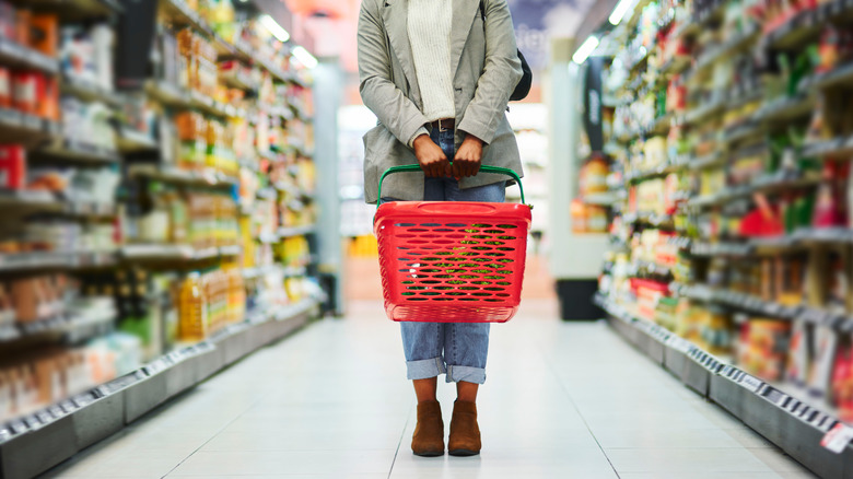 person standing in a grocery aisle