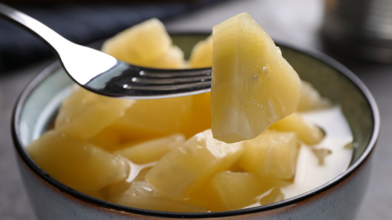 Canned pineapple on fork