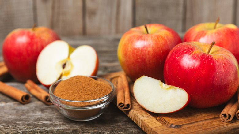 Red apples and cinnamon sticks