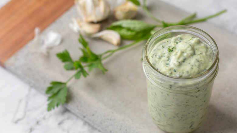 A mason jar of green goddess dressing
