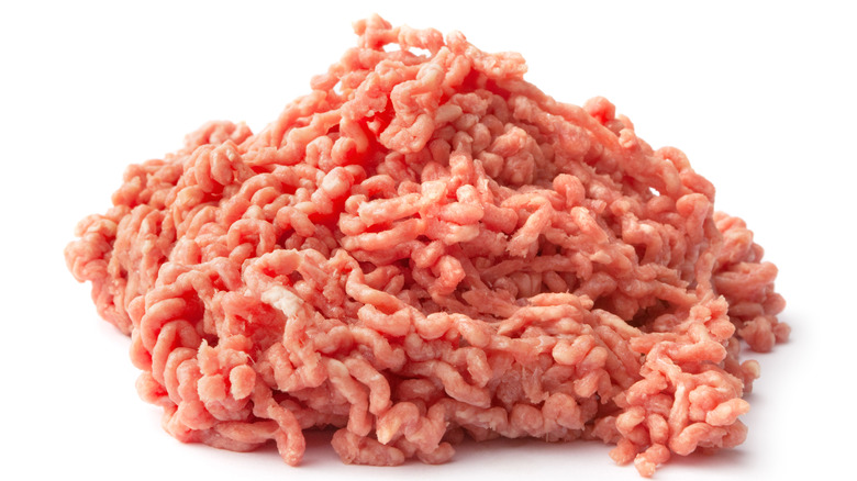 A pile of ground beef on a white background