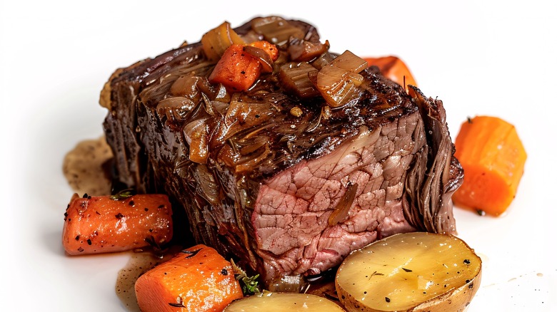 A pot roast with carrots and potatoes