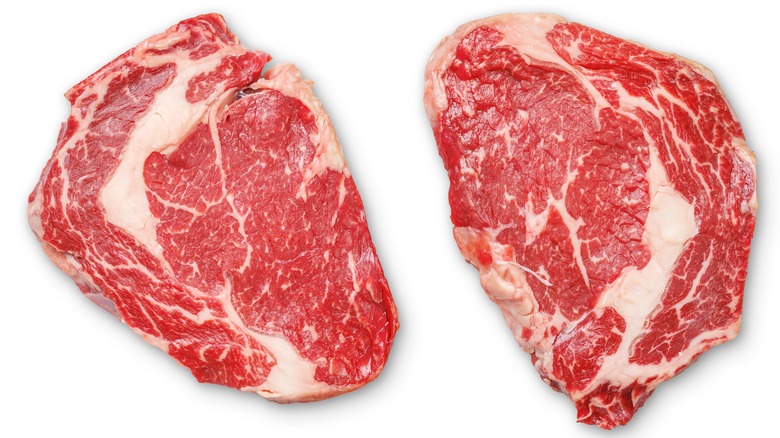 Raw ribeye steaks