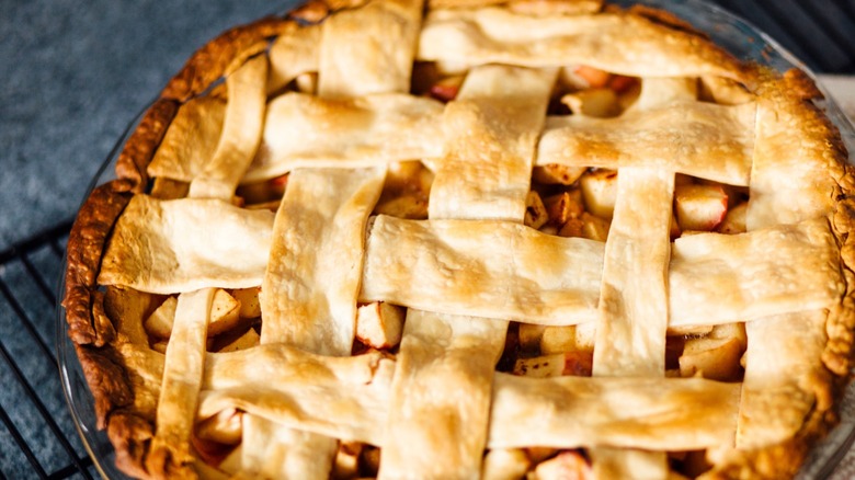 Warm apple pie on a cooling rack