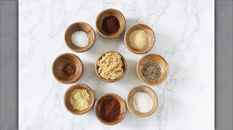 barbecue spices in wooden bowls