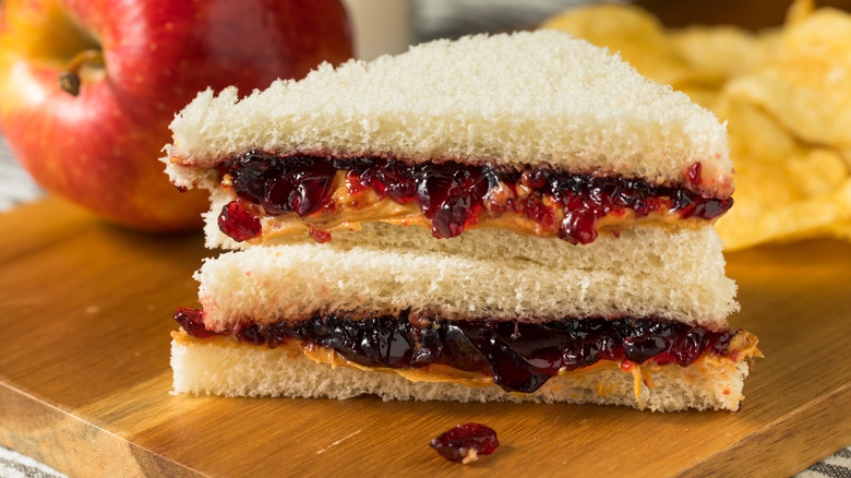 Stacked halves of PB&J with crusts cut off