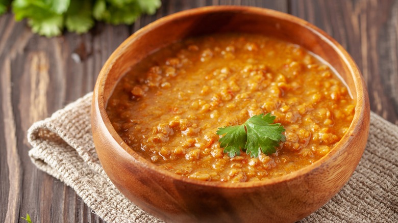 Wooden bowl of dal