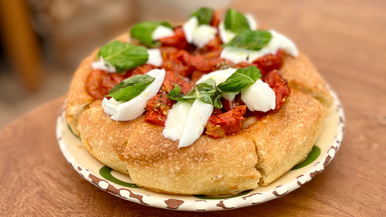 Focaccia topped with San Marzano tomatoes, basil, and mozzarella