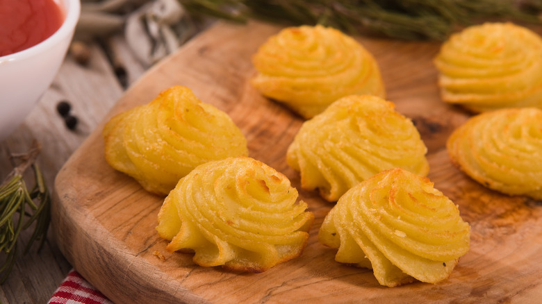 Duchess potatoes on cutting board