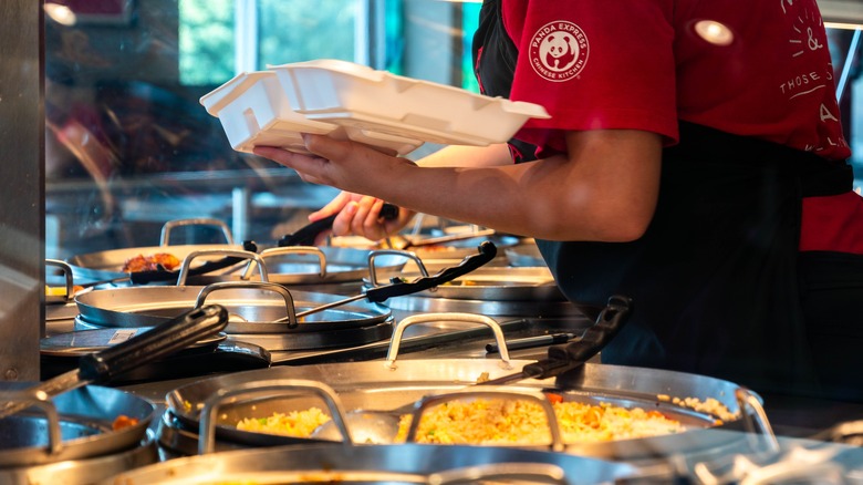 server dishes up food at Panda Express