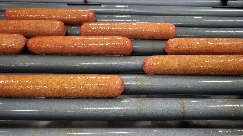 Hot dogs on a roller grill