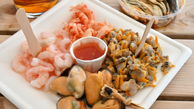 Plate of seafood and cocktail sauce