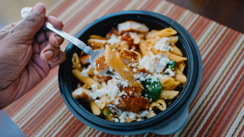 pasta eaten in takeout container