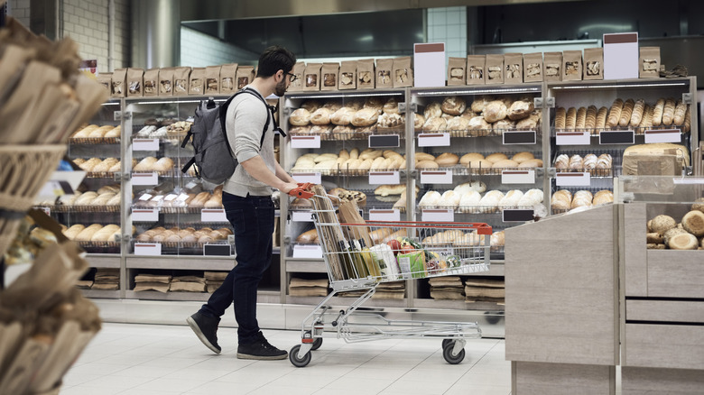 shopper in grocery store bakery