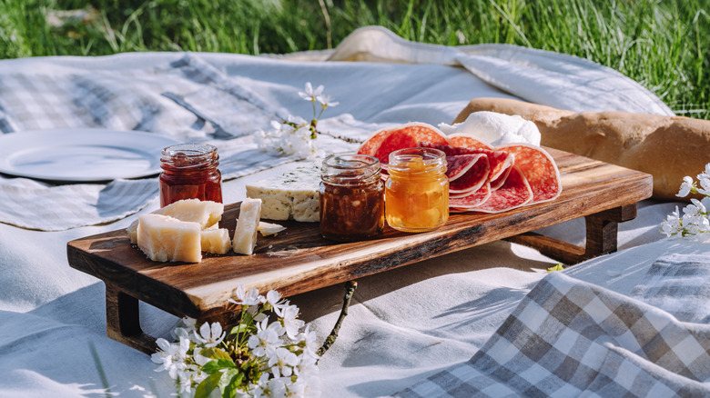 A picnic board set up on a blanket
