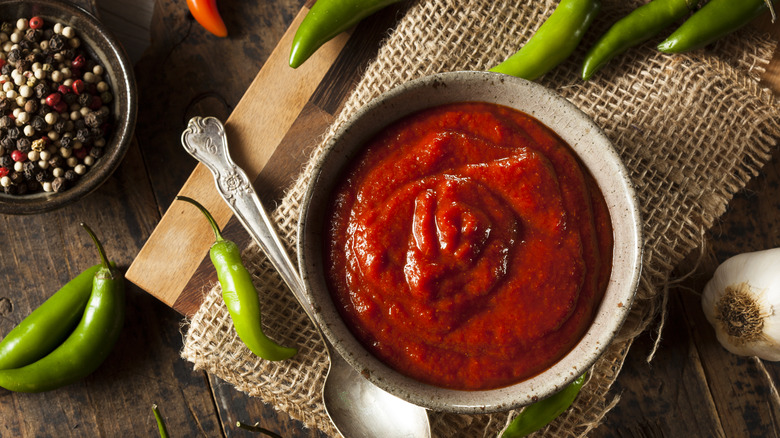 Bowl of sriracha with peppers and seasonings