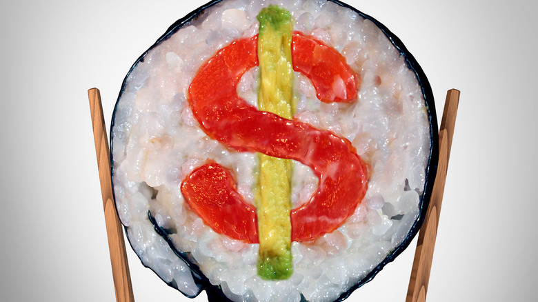 A pair of chopsticks holding a piece of a sushi roll with a dollar sign in the filling.
