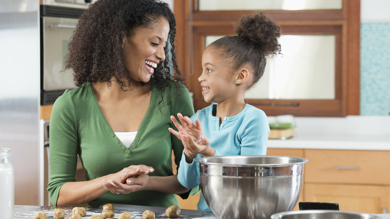 Woman and child making cookie dough