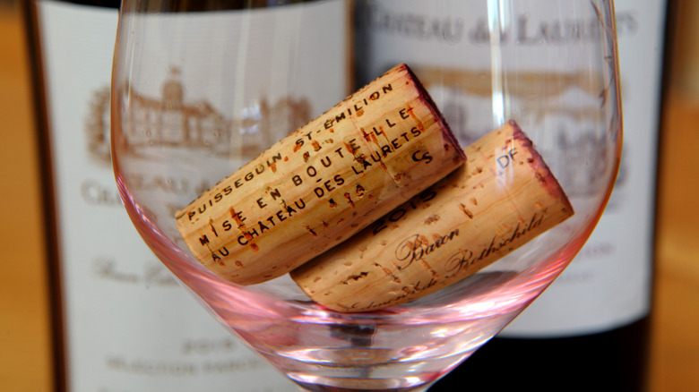 Wine corks in a glass.
