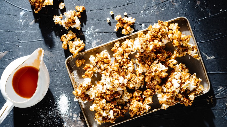 Buffalo seasoned popcorn with excess sauce