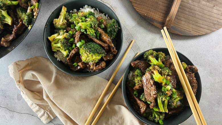two bowls of beef and broccoli