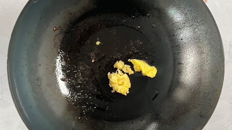 minced garlic and ginger in wok