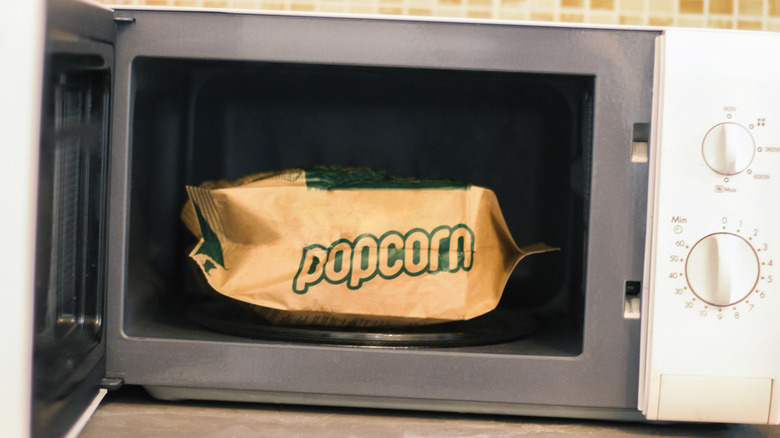 Popcorn bag in open microwave