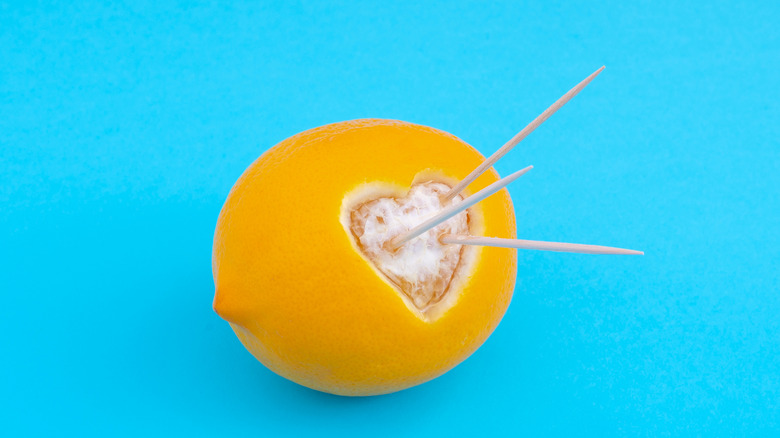 lemon with heart design and toothpicks