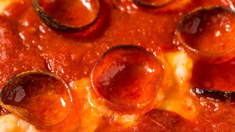 Close up of pepperoni cups on a Detroit-style pizza