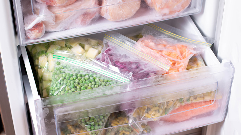 Freezer stocked with meat and vegetables