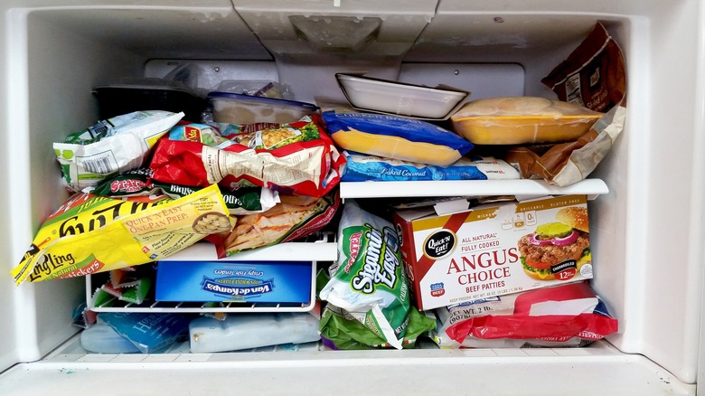 Messy freezer with boxed items