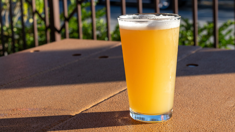 IPA beer in glass outside