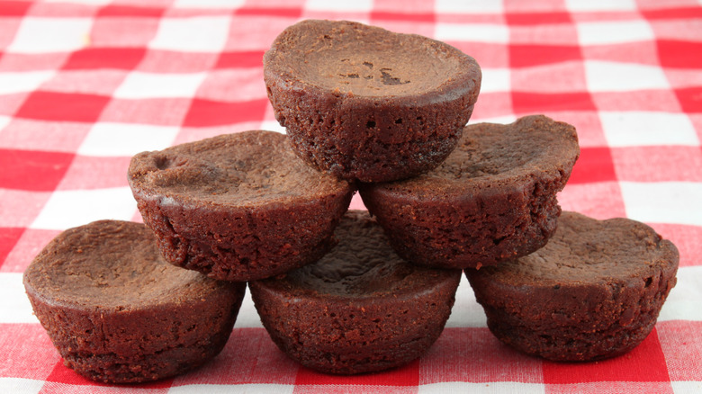 mini brownie bites on a red checkered tablecloth