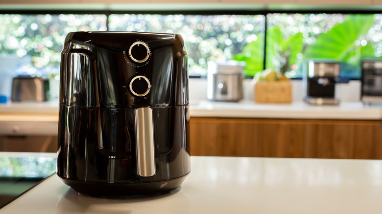 black air fryer on a kitchen counter